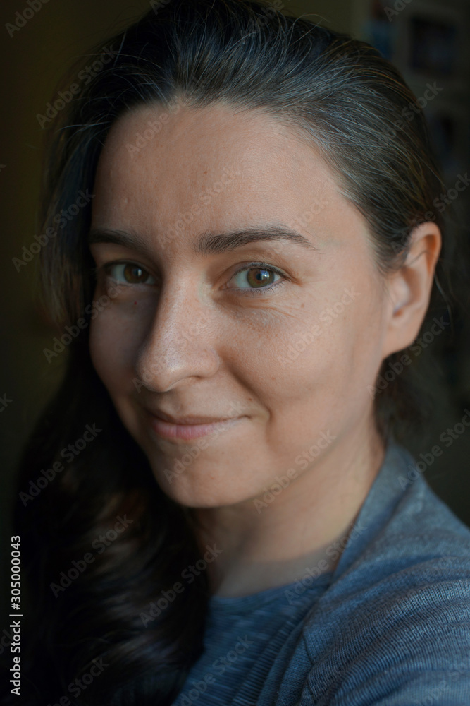 Portrait of a woman without makeup with a little gray hair Portrait of a woman without makeup with a little gray hair