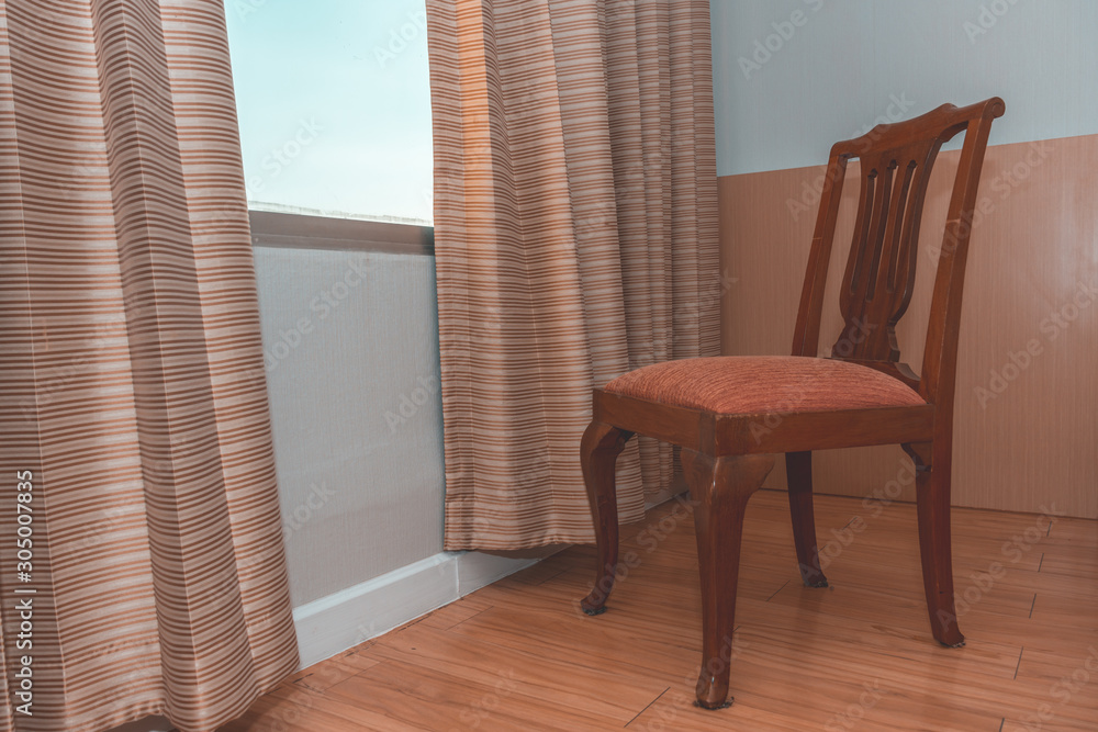 Fototapeta premium A chair near glass window