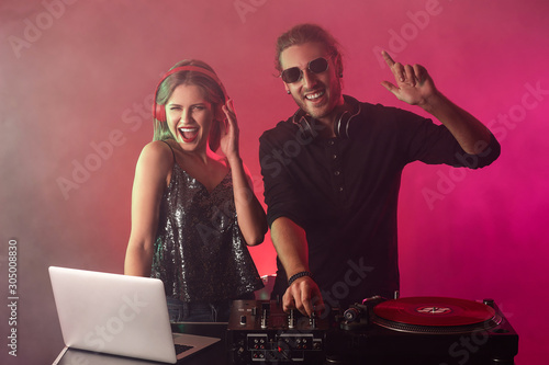 Young djs playing music in ...