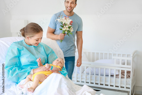 Newborn baby with happy mot...