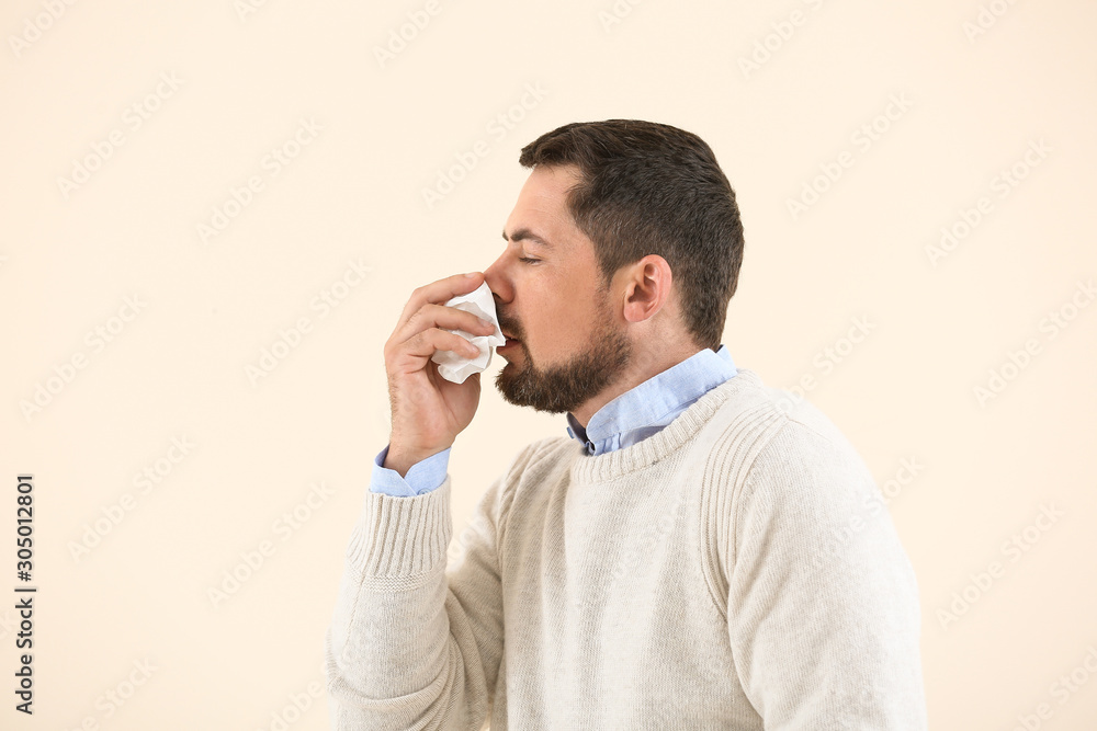 Man ill with flu on light background Man ill with flu on light background