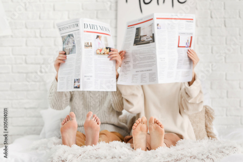Beautiful young couple read...