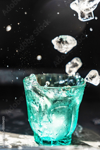 ice cubes flying in the glass
