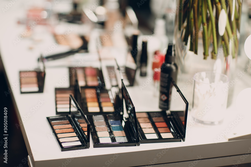 Obraz premium Cosmetics, eye shadow, powder box and other makeup products