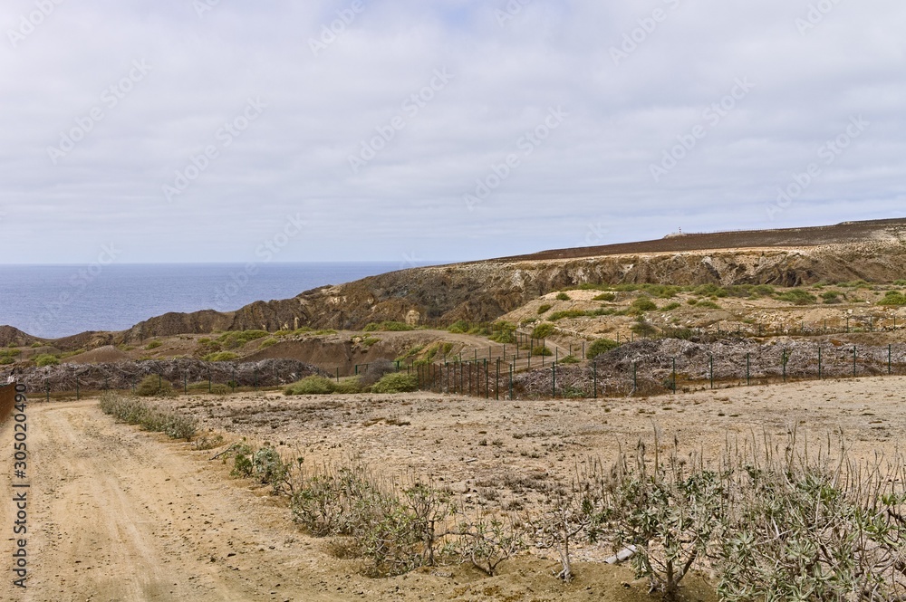 Dirt road in a desertic place near Atlantic Ocean (Porto Santo, Madeira Islands, Portugal, Europe)
