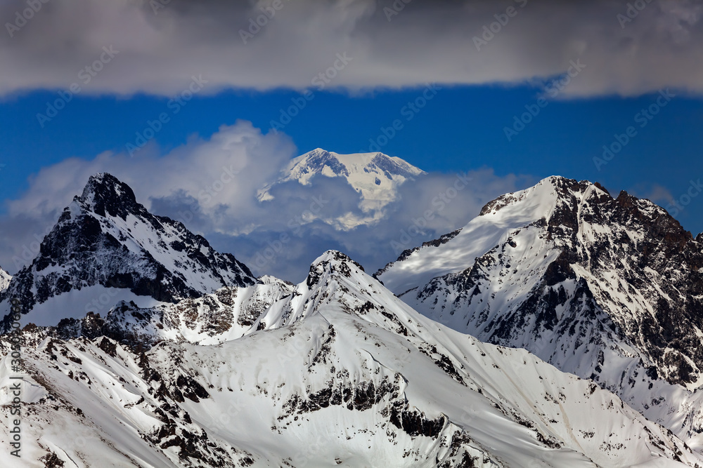 the Caucasus mountains on the background of mount Elbrus (Dombai, Russia)