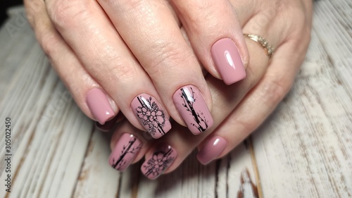 Trendy manicure design on a beautiful background.