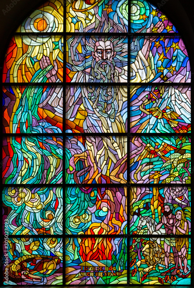 Zegiestow, Poland. 2019/8/10. Stained-glass window depicting the Creation of the World with the words 