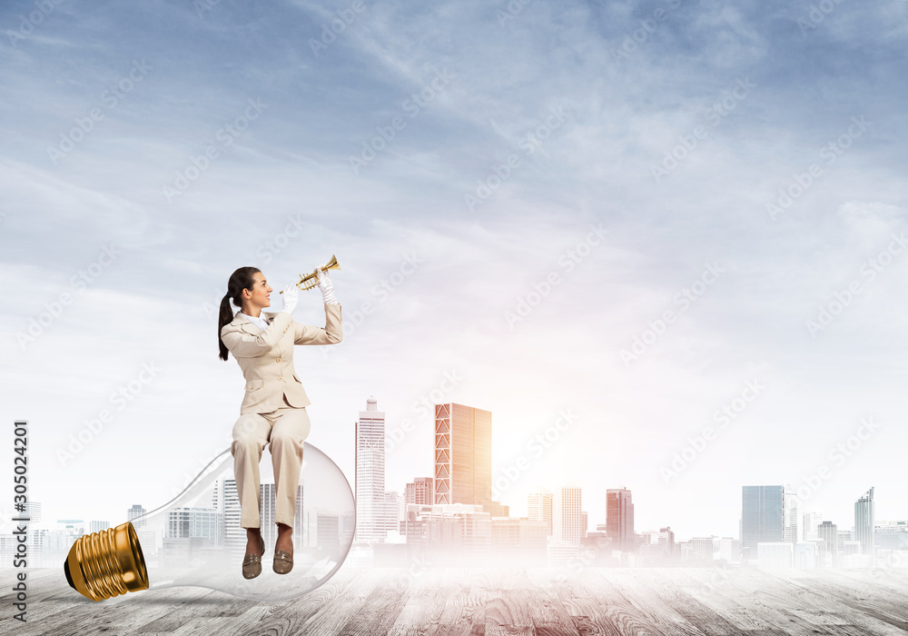 Attractive woman playing trumpet brass Attractive woman playing trumpet brass