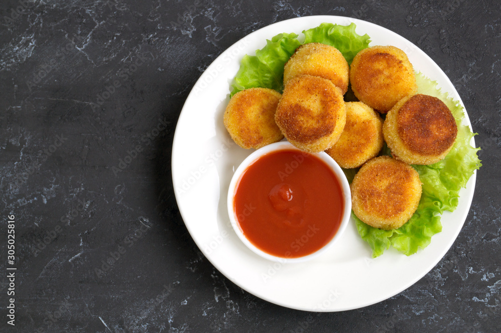 breaded fried potato balls with tomato sauce breaded fried potato balls with tomato sauce