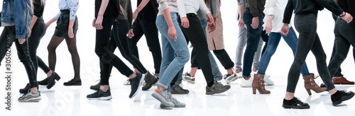 casual young people walking in different directions photo