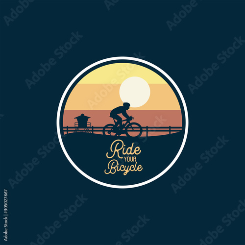 mountain bike badge jump silhouette yellow sky background. logo sign patch design
