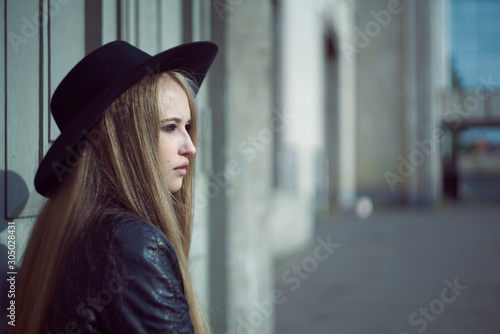 woman tourist walking on the street, summer fashion style, travel to Europe