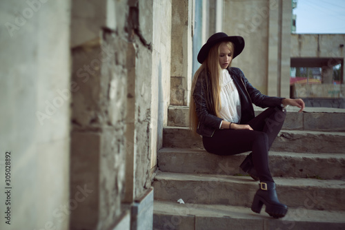 woman tourist walking on the street, summer fashion style, travel to Europe