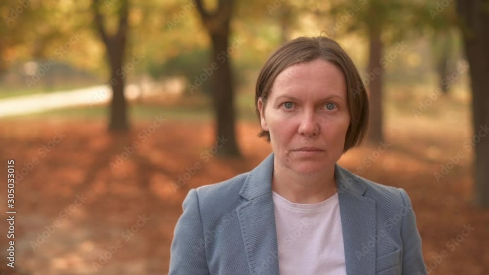 Portrait of businesswoman in autumn park Portrait of businesswoman in autumn park