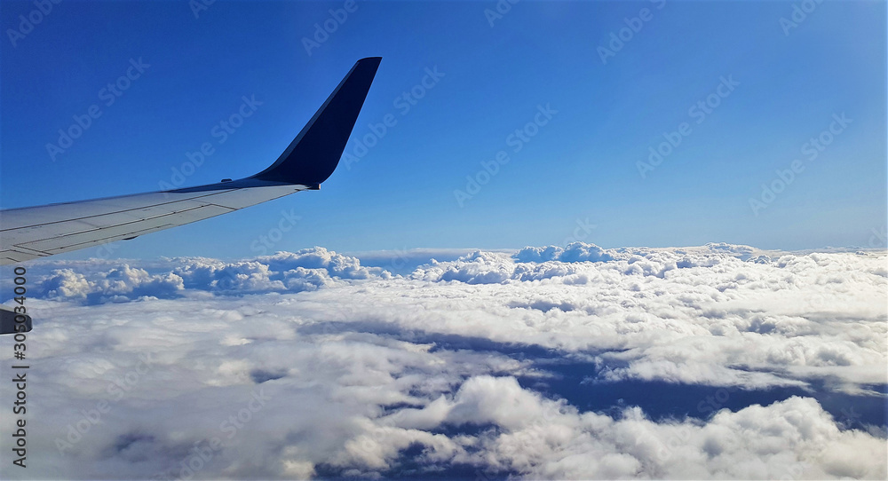 landscape above the clouds seen from the plane landscape above the clouds seen from the plane