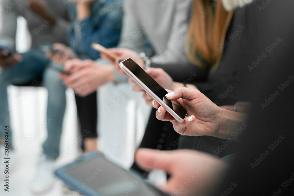 image of a young man reading mail on his smartphone image of a young man reading mail on his smartphone