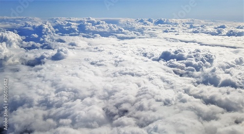 flying above a ceiling of clouds