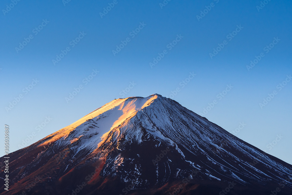 Plakat Mt. Fuji crater peak snow covered in the morning With beautiful sunlight.