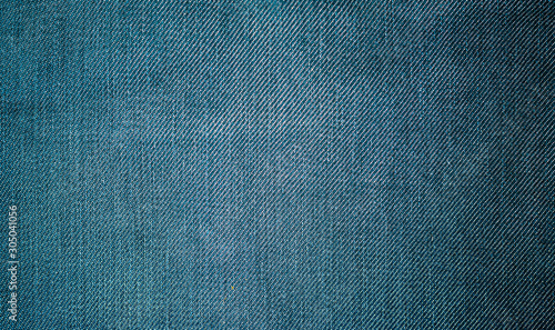 Perspective and closeup view to abstract space of empty light blue natural clean denim texture for the traditional business background in cold bright colors .