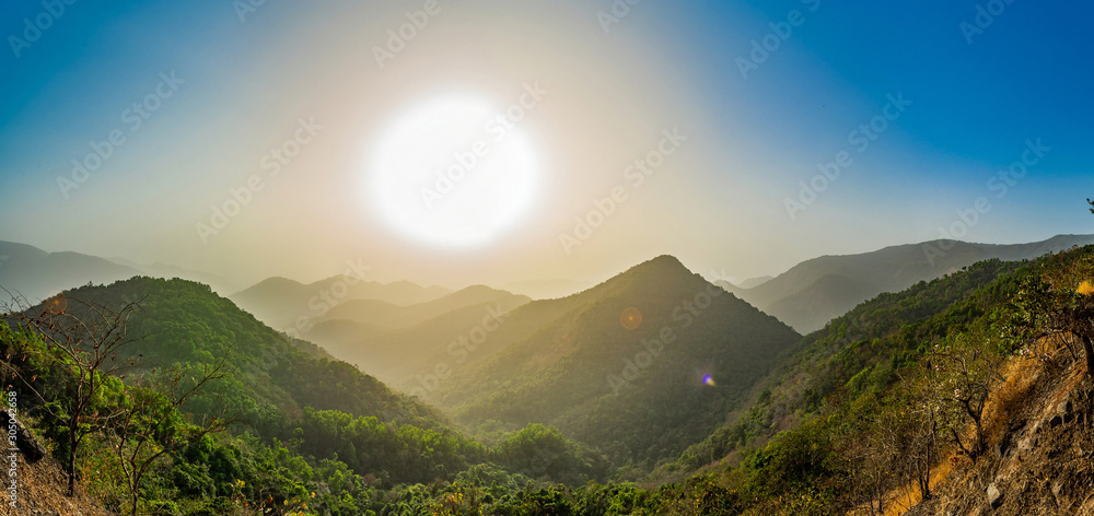 Panorama of a sunset at Indian Mountains, Goa,India - obrazy, fototapety, plakaty 
