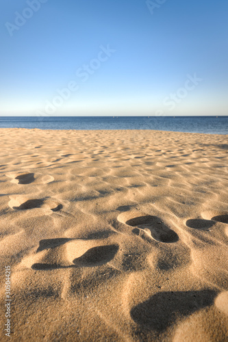 footprints in sand at beach