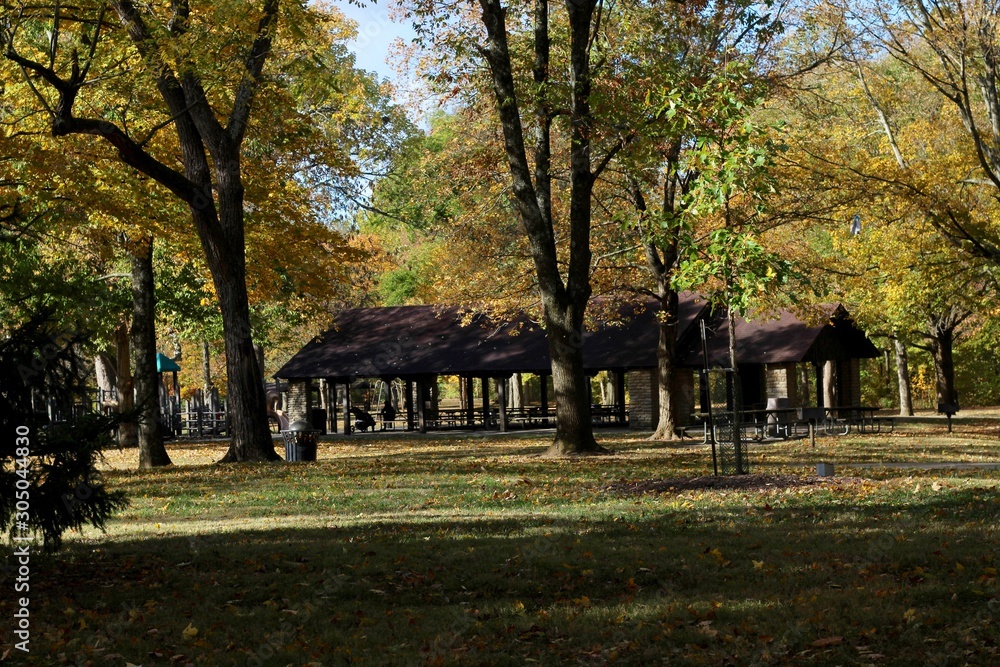 The empty picnic shelter in the park on a fall day.