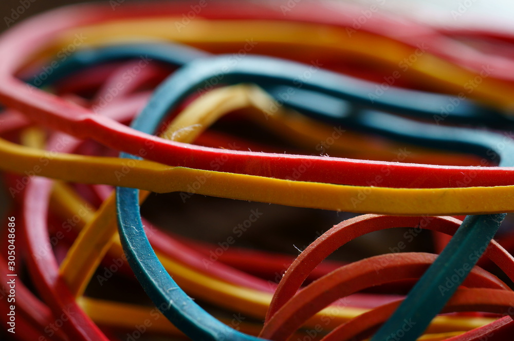 colorful rubber bands on white background