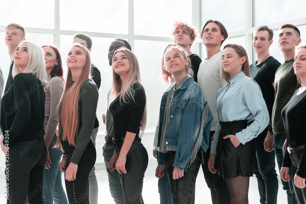 Fototapeta premium organized group of casual young people looking up