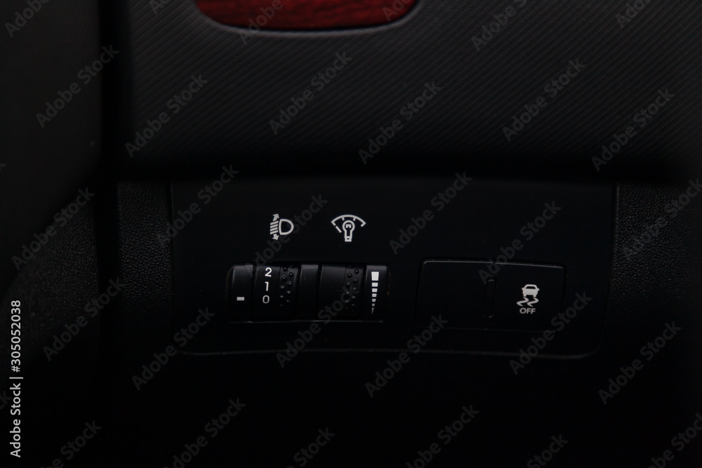 Black button for turning on and off the electronic system of vehicle