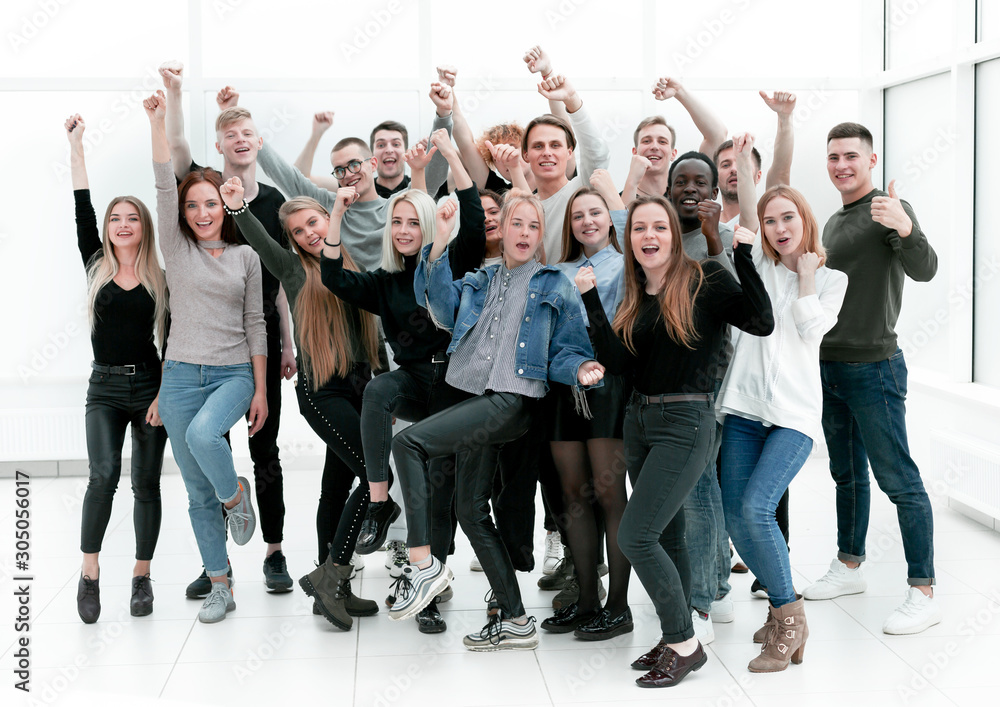 Fototapeta premium group of happy youths who are pointing ahead