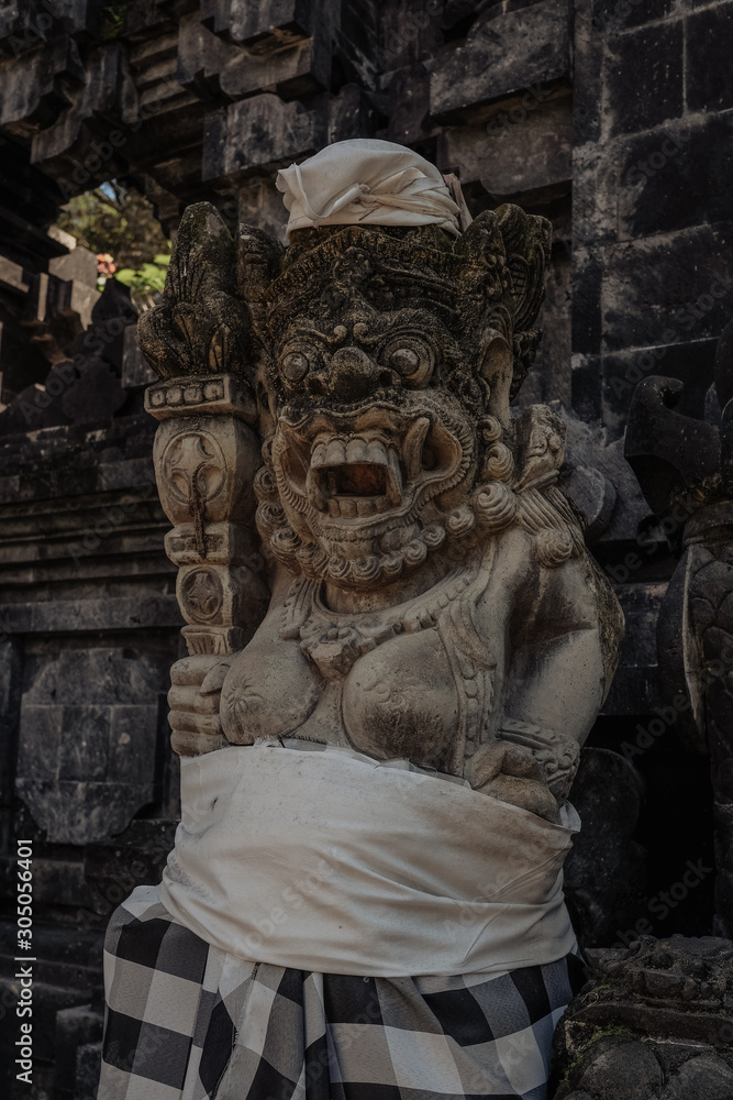 statue with white cloth Bali Indonesia