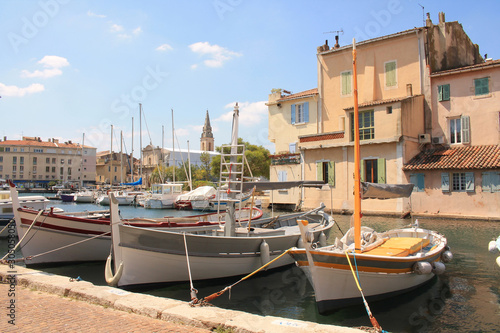 The old harbor of Martigues with traditional wooden boat. Martigues, called the Little Venice of Provence, France