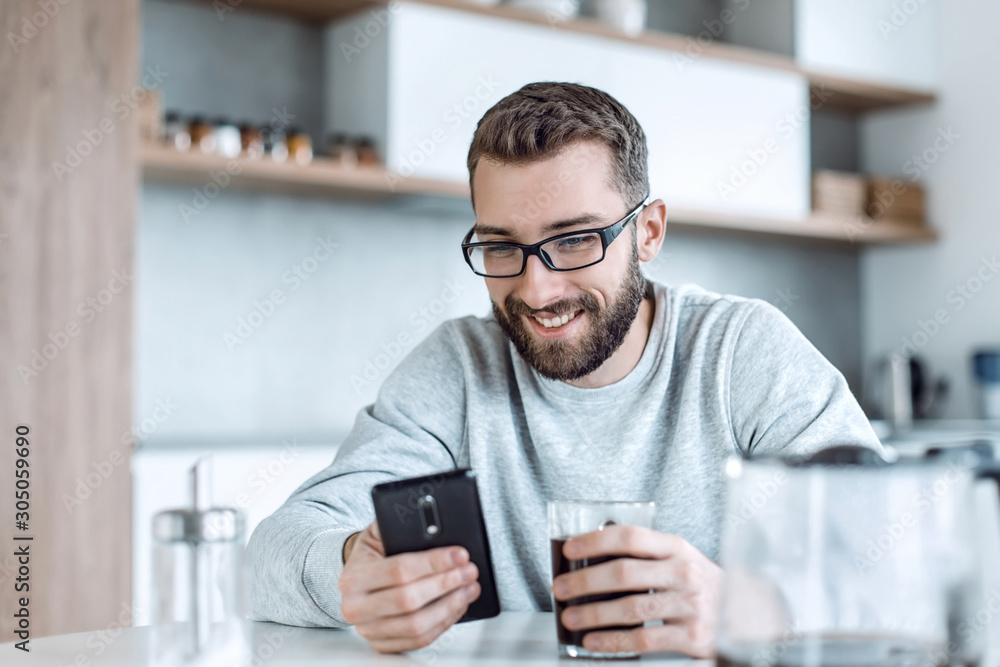 close up. man reading e-mails during Breakfast close up. man reading e-mails during Breakfast