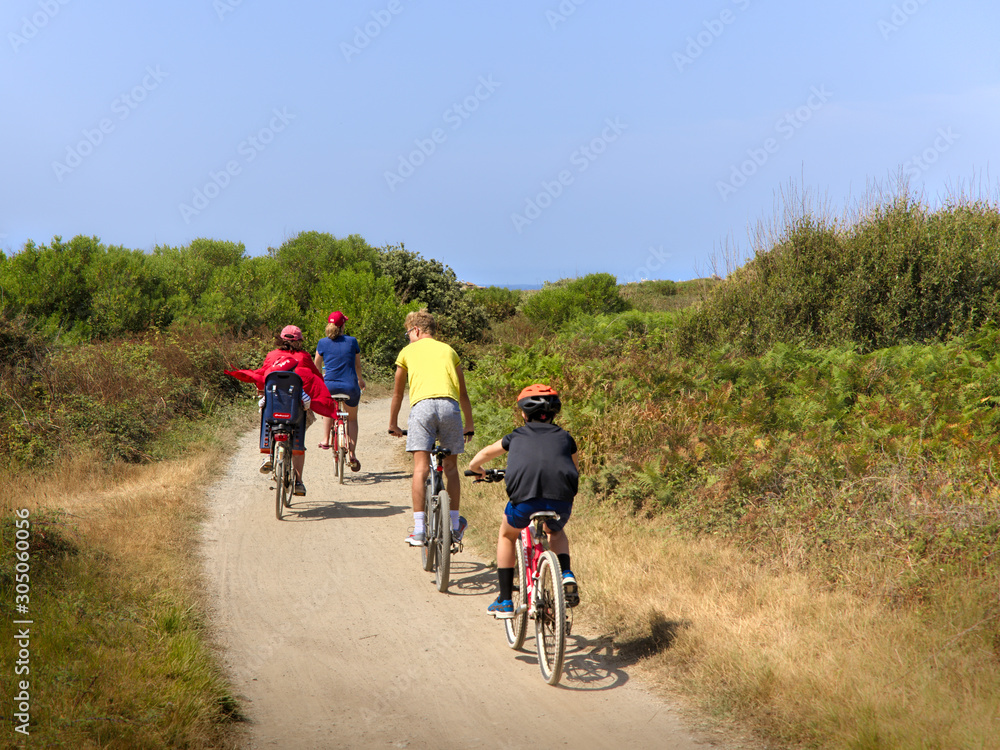 people riding bicyclein nature