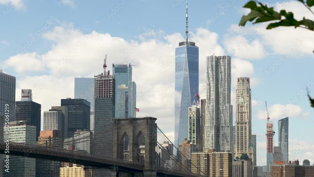 Brooklyn Bridge in NYC & Skyline Panning Left as seen from across the East River