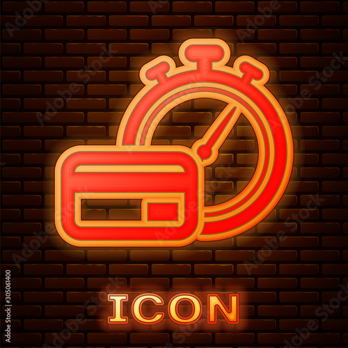 Glowing neon Fast payments icon isolated on brick wall background. Fast money transfer payment. Financial services, fast loan, time is money, cash back concept. Vector Illustration