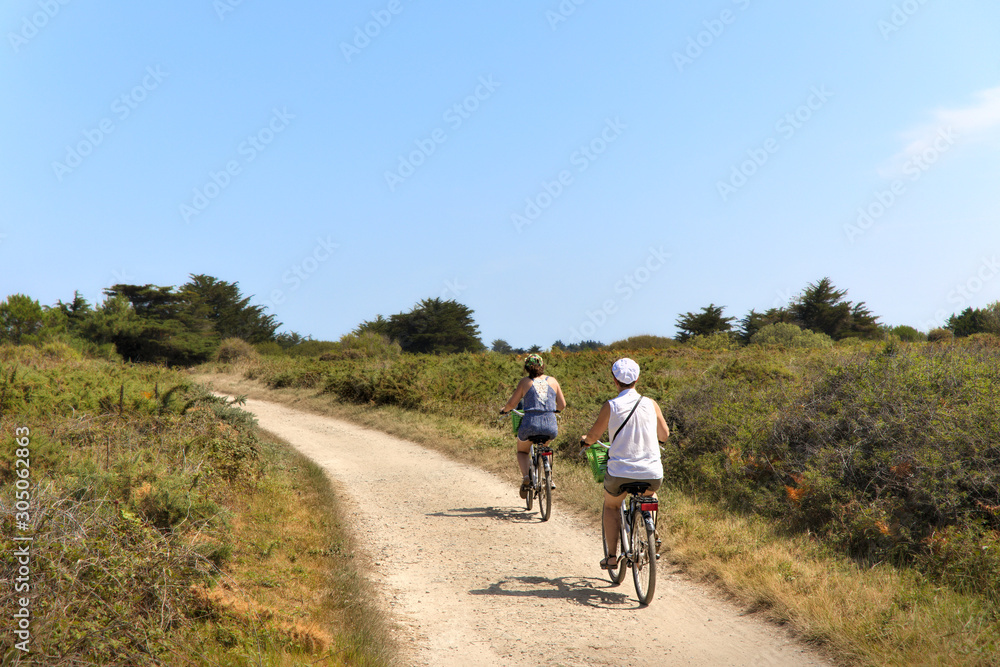 people riding bicyclein nature people riding bicyclein nature