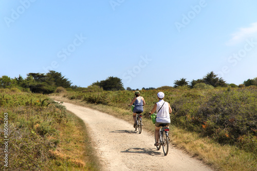 people riding bicyclein nature