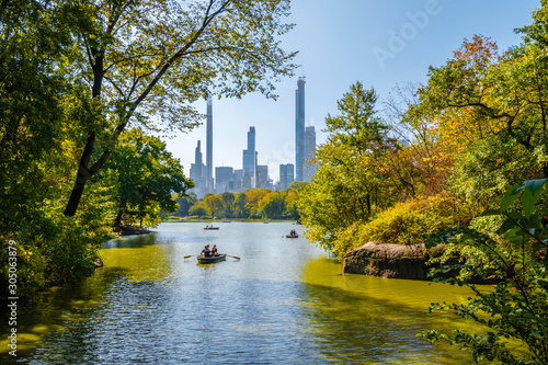 Canvas Print Row boats in lake in Central Park with skyscrapers in distance, Manhattan, New Y