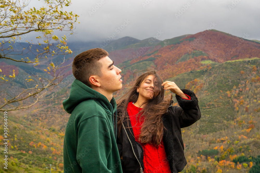 girl and boy enjoy the views of the mountain