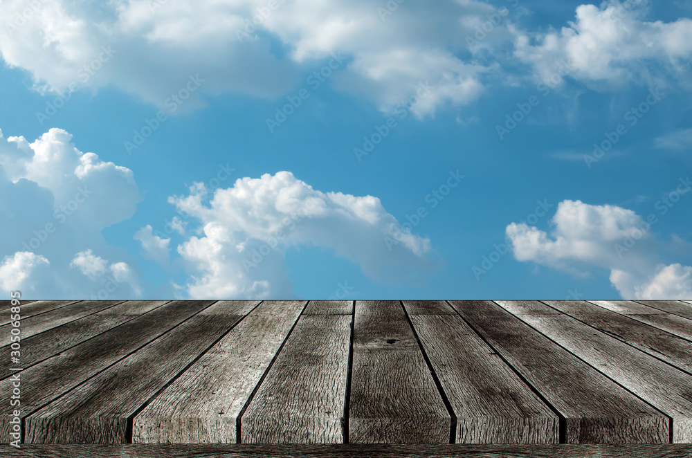 empty grey wooden top table or blank wooden terrace with beautiful view blue sky and cloud, copy space for display of product or object presentation and advertisement concept