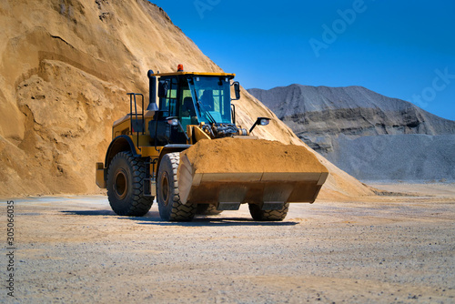 Track-type bulldozer  earth-moving equipment. Land clearing  grading  pool excavation  utility trenching and foundation digging during of large construction jobs.