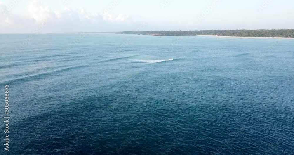 Flying over the blue Indian ocean with a drone on the Swahili coast, Tanzania. Flying over the blue Indian ocean with a drone on the Swahili coast, Tanzania.