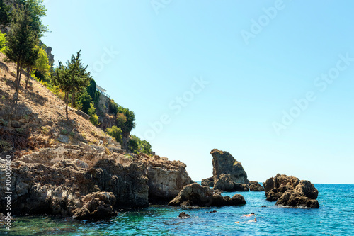 The mountains and sea scenery with blue sky, beautiful nature. Summer time. Vocation concept. Selective focus.