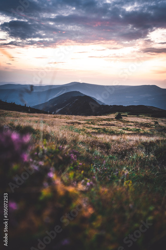 Sunset behind the mountains in national park Krkonose, Czech Republic
