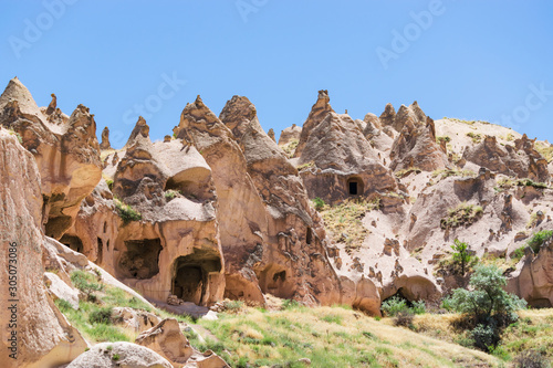 Ancient volcanic stones with caves and holes, Cappadocia, Turkey.
