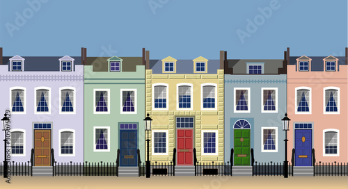 Colorful city house facades on a sunny street.