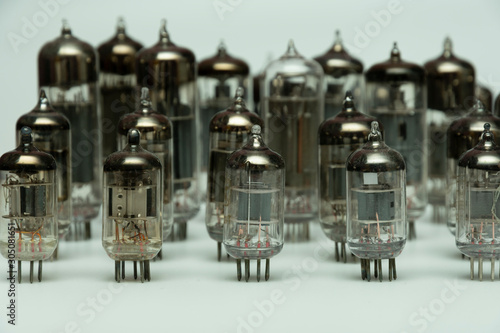 different vintage vacuum lamps for electronic amplifiers, audio players and tube TVs on a white background