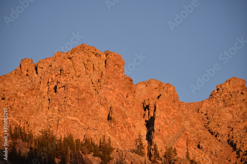 The sun sets over the mountains of the Colorado Rockies.